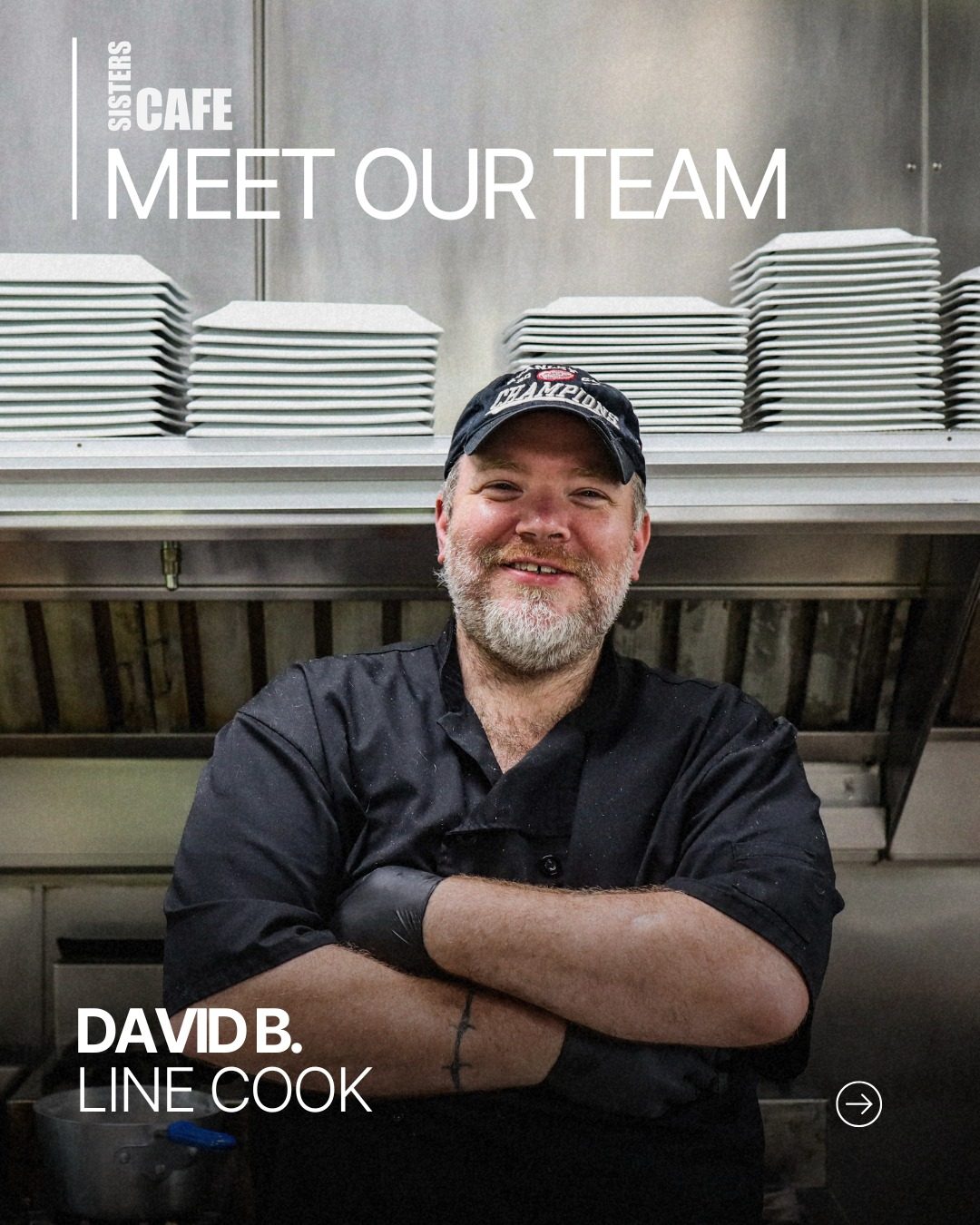 David B., line cook at Sisters Cafe, standing with his arms crossed in the kitchen
