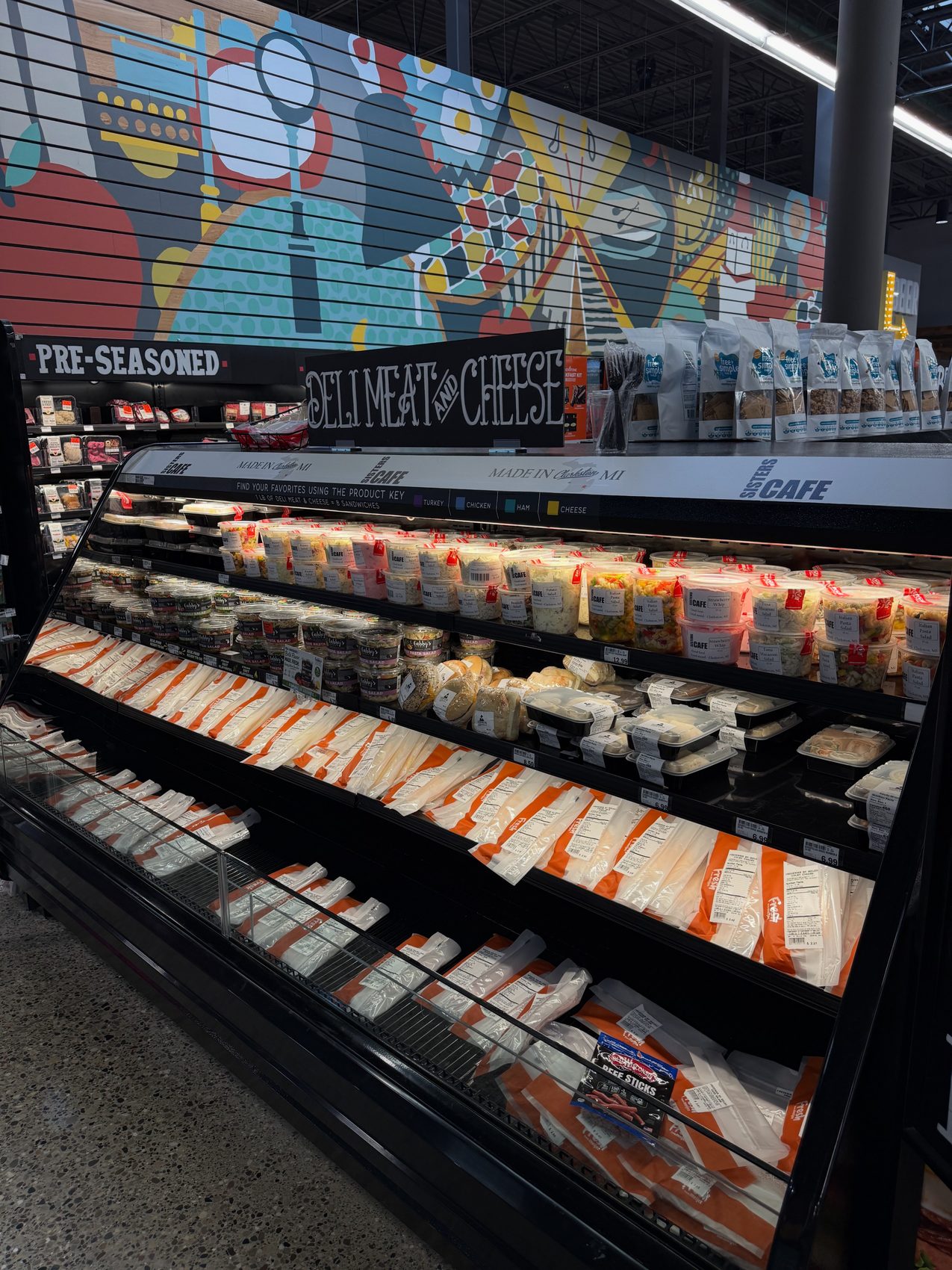 The full deli case at Meijer Independence Market stocked with prepared foods