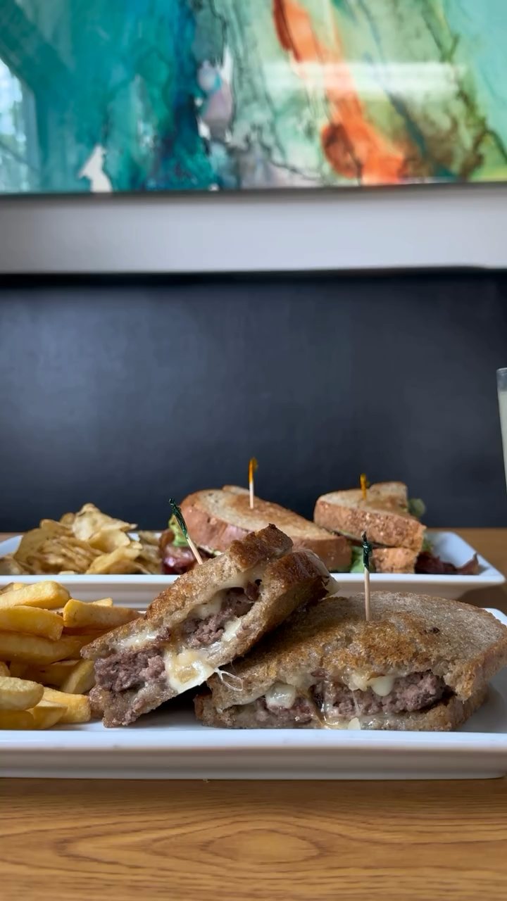 Patty melt on grilled rye with french fries